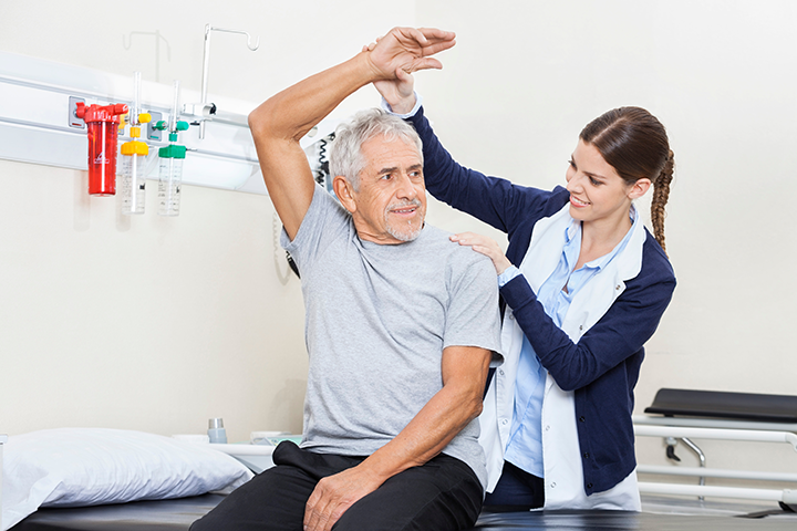 nurse testing range of motion in assisted living care
